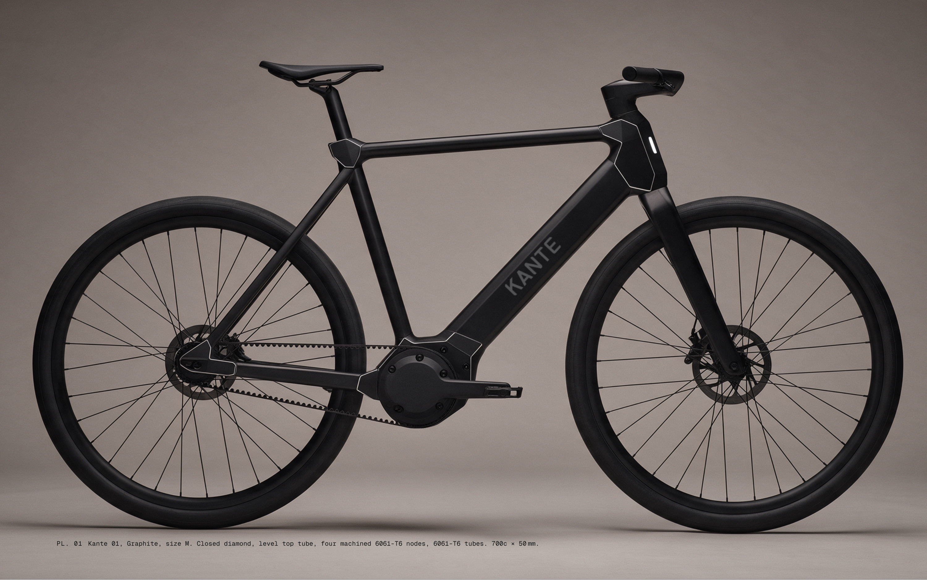 PL. 01 Kante 01, Graphite, size M. Closed diamond, level top tube, four machined 6061-T6 nodes, 6061-T6 tubes. 700c × 50 mm.