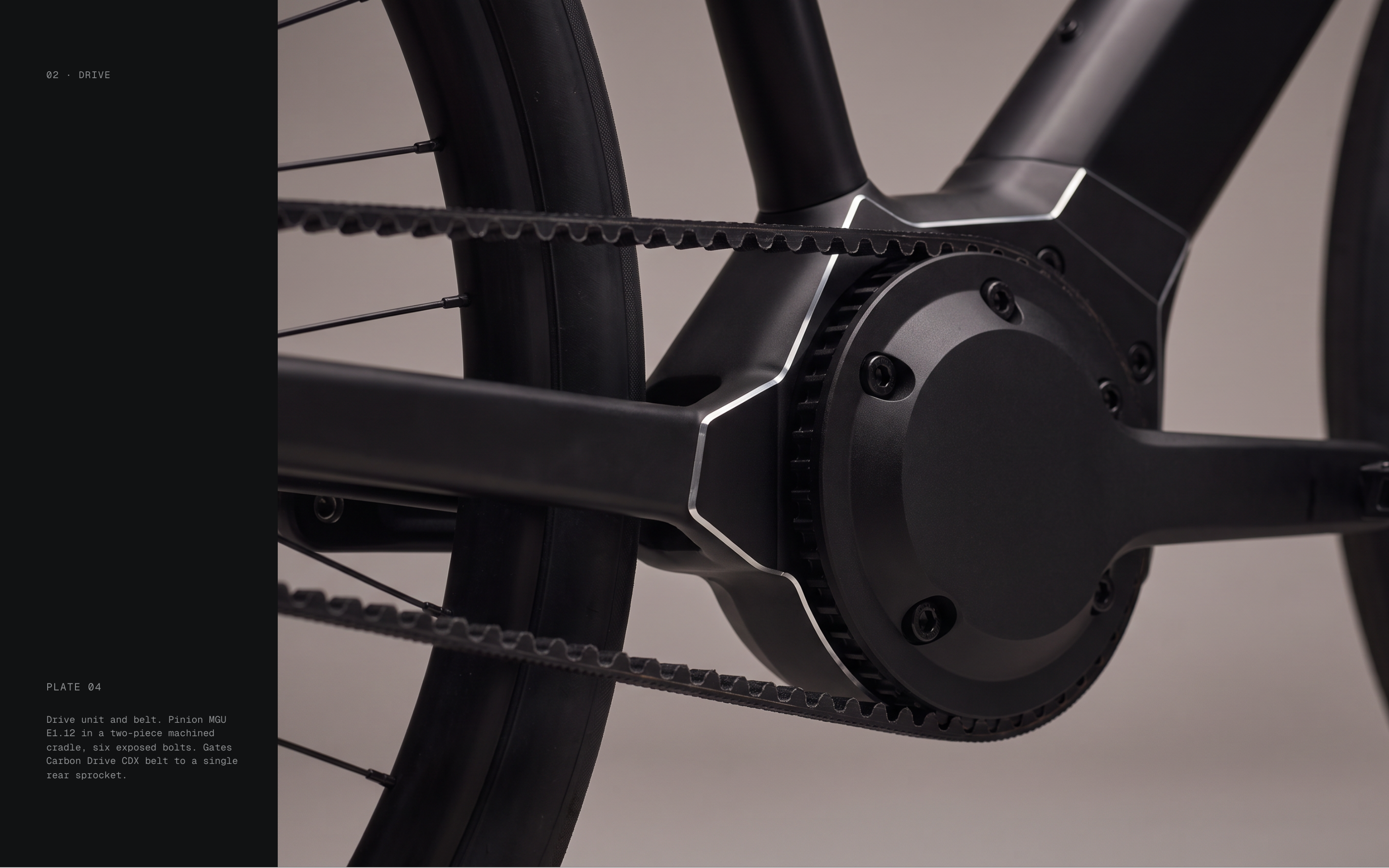 02 · DRIVE PLATE 04 Drive unit and belt. Pinion MGU E1.12 in a two-piece machined cradle, six exposed bolts. Gates Carbon Drive CDX belt to a single rear sprocket.