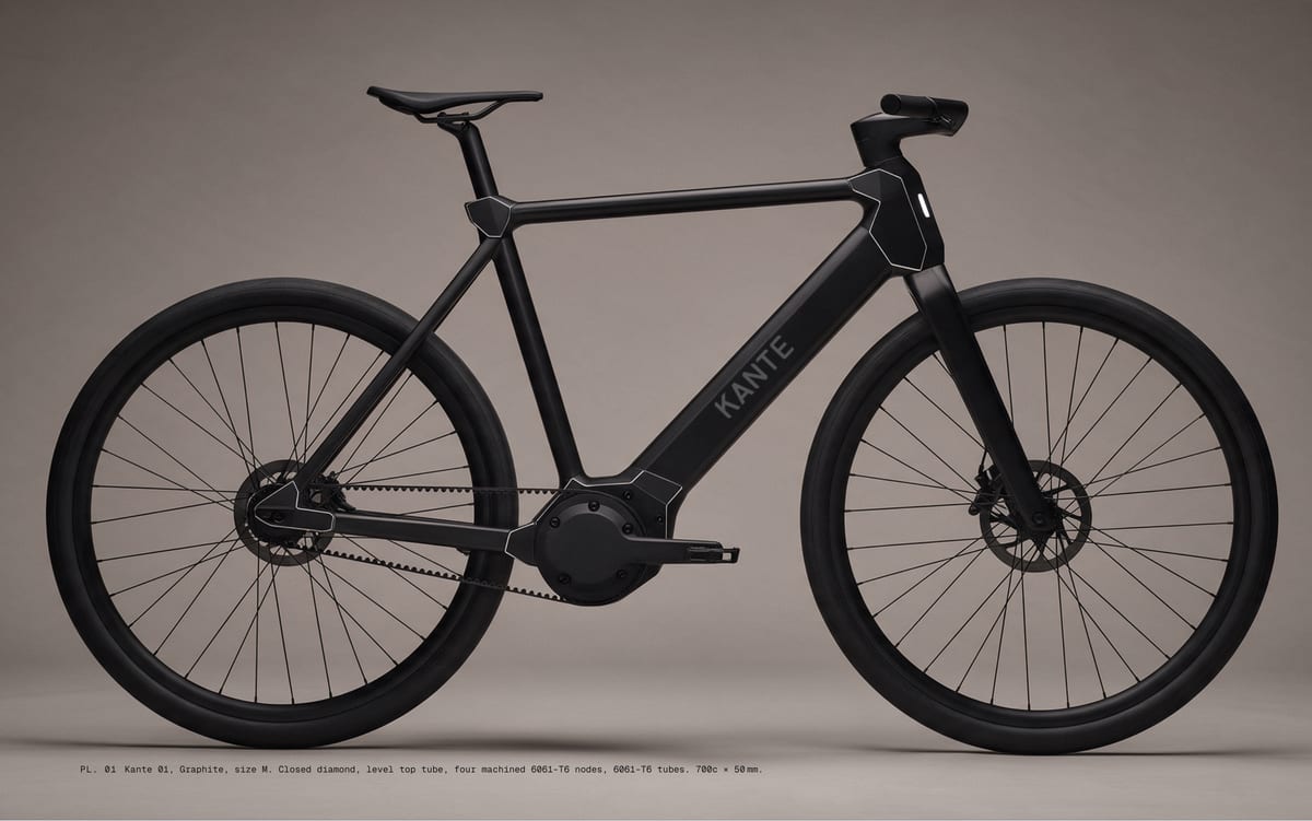 PL. 01 Kante 01, Graphite, size M. Closed diamond, level top tube, four machined 6061-T6 nodes, 6061-T6 tubes. 700c × 50 mm.